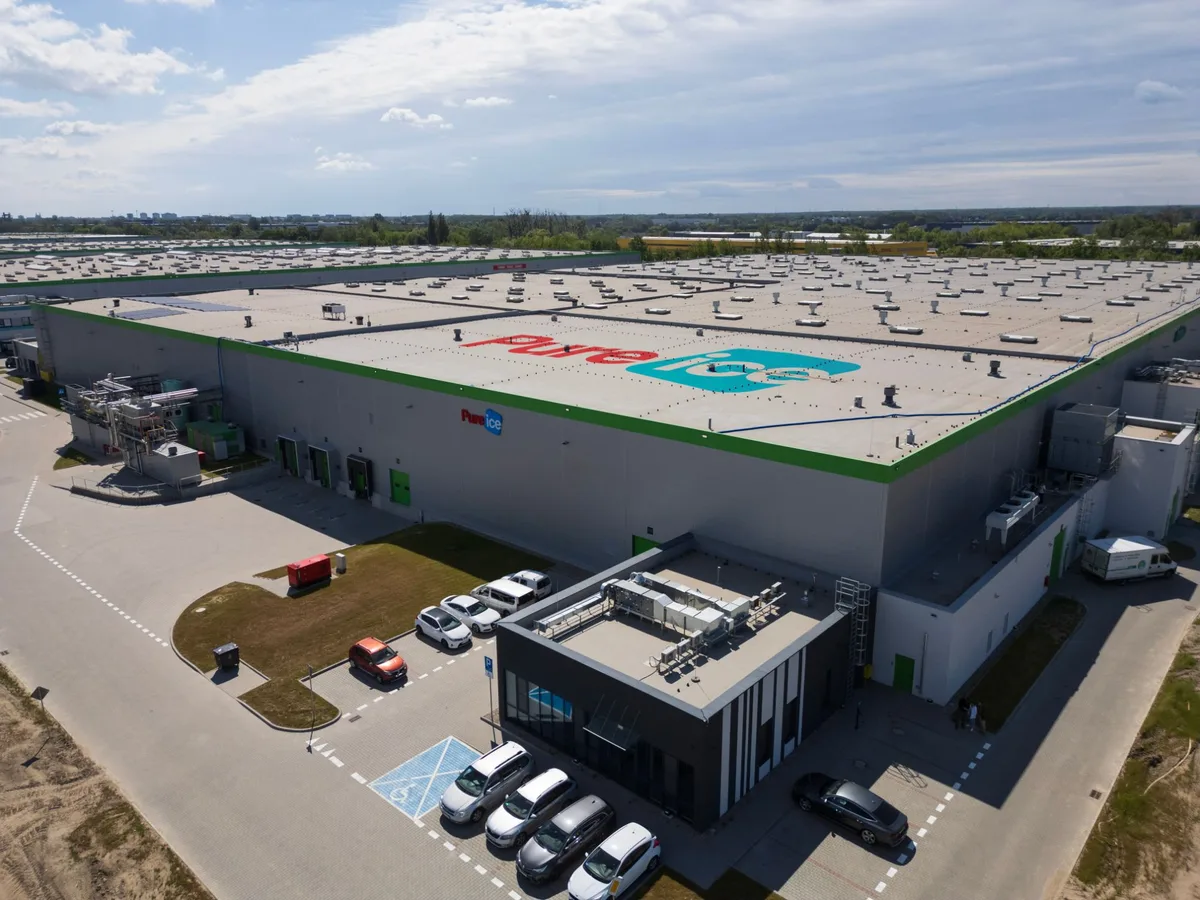 Pure Ice production plant in Brwinów from above — the hall with the Pure Ice logo on its roof